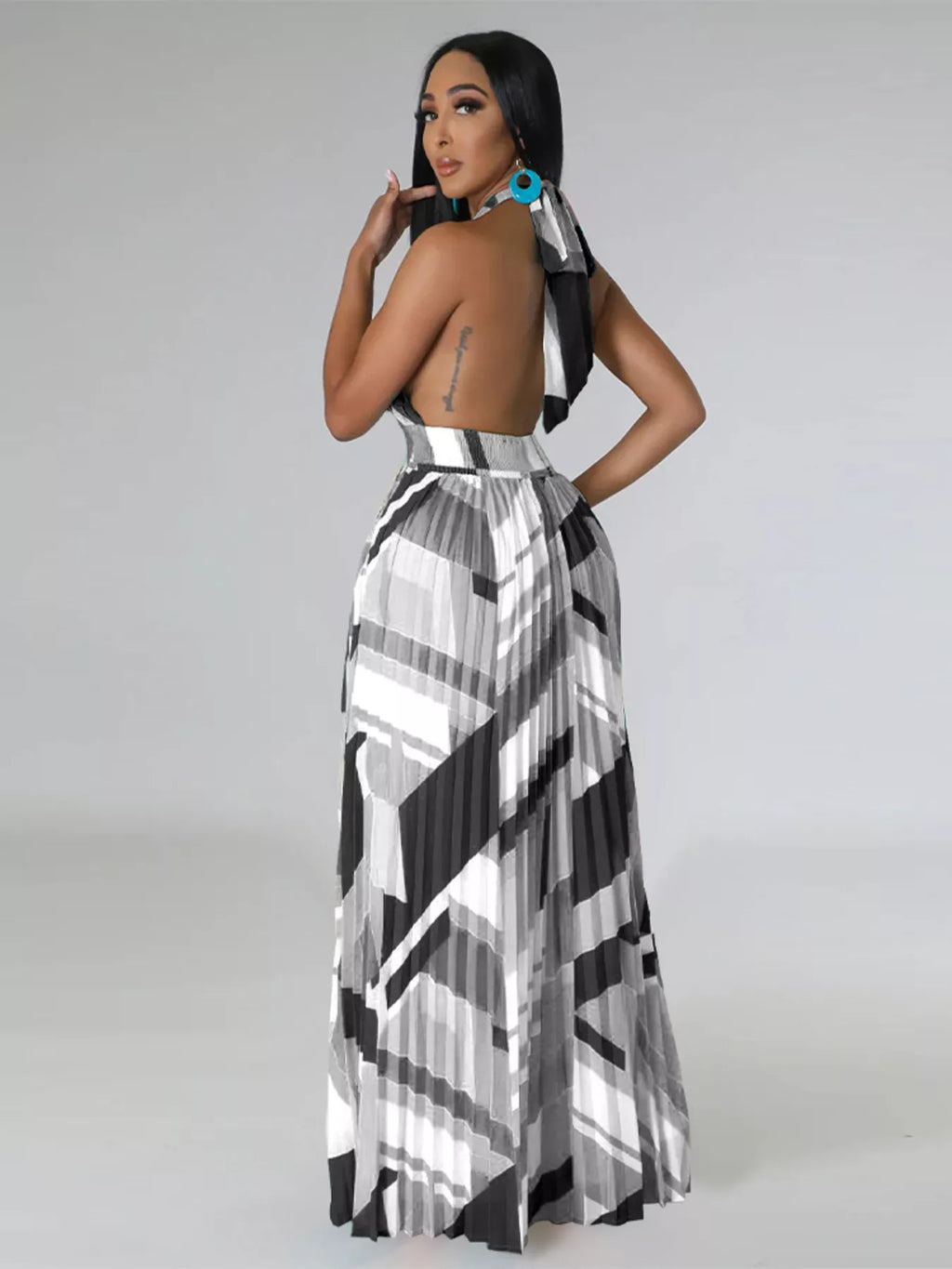 The Halter Geometric Pleated Maxi Dress
