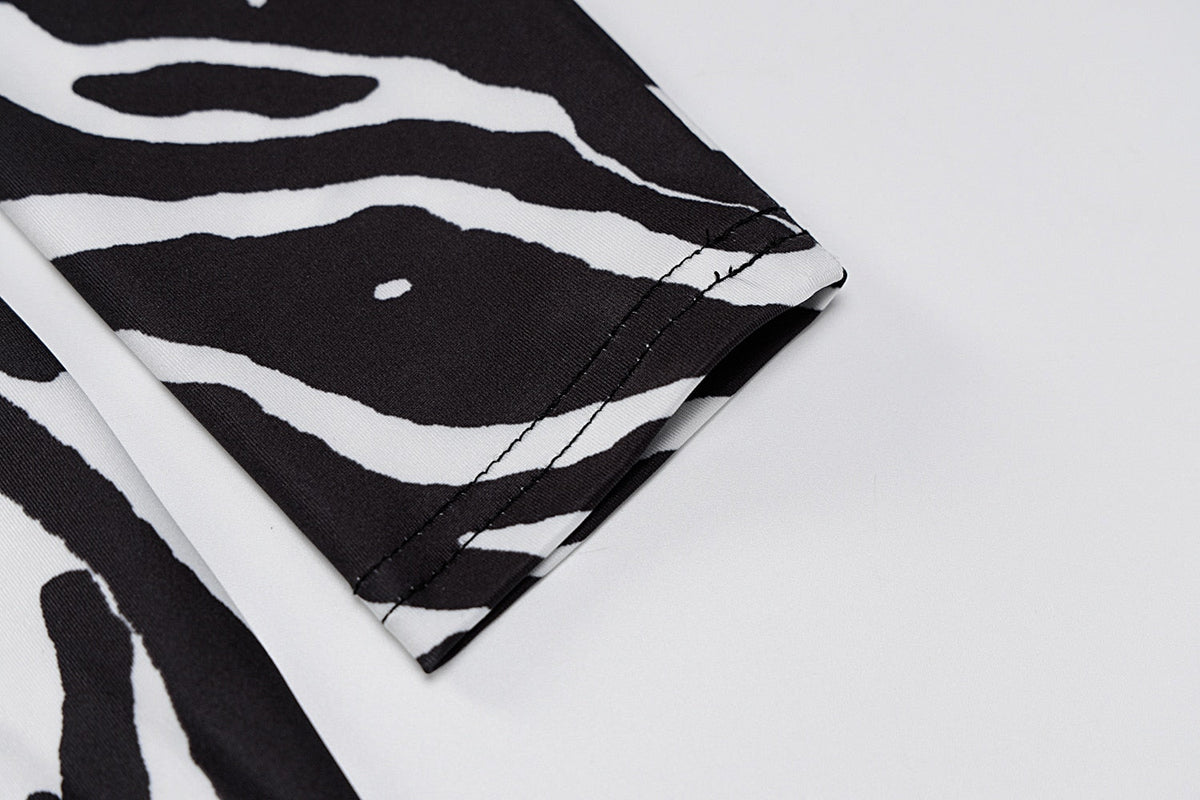 The Zebra Social Plunge Mini Dress